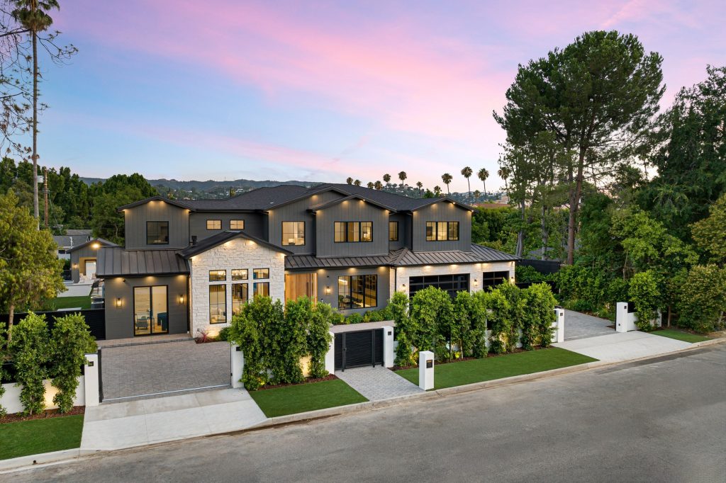Modern luxury home exterior at sunset