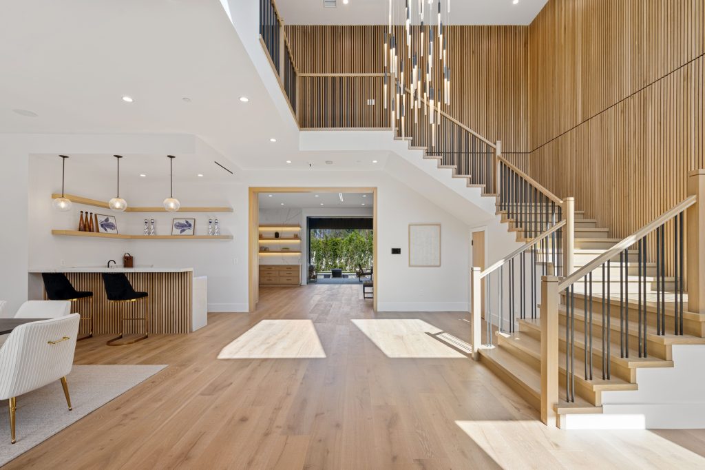 Modern open-concept living space with wooden accents.
