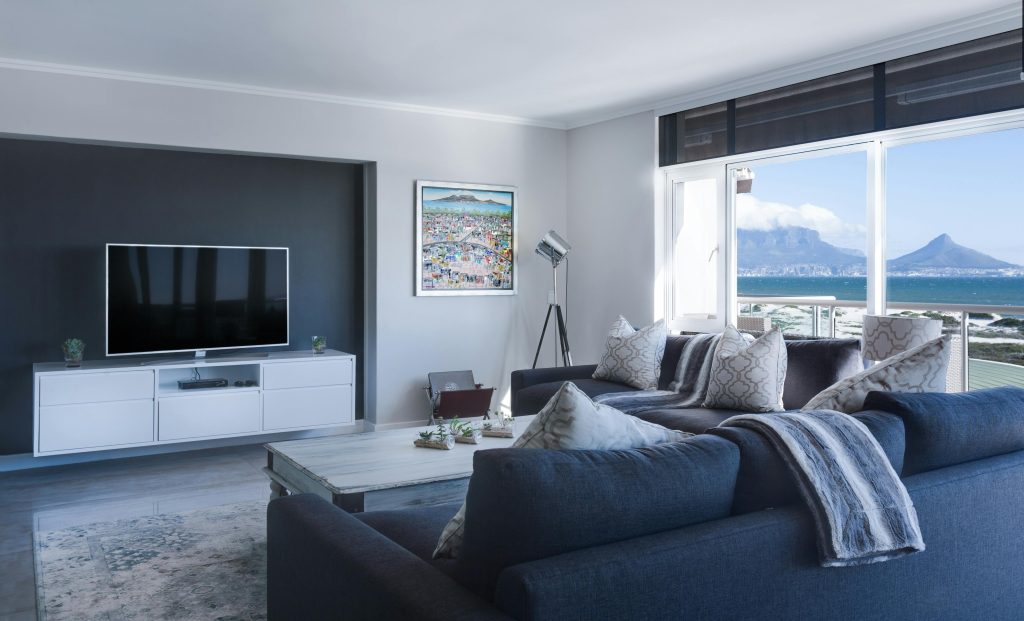 Modern apartment lounge room with beach view.