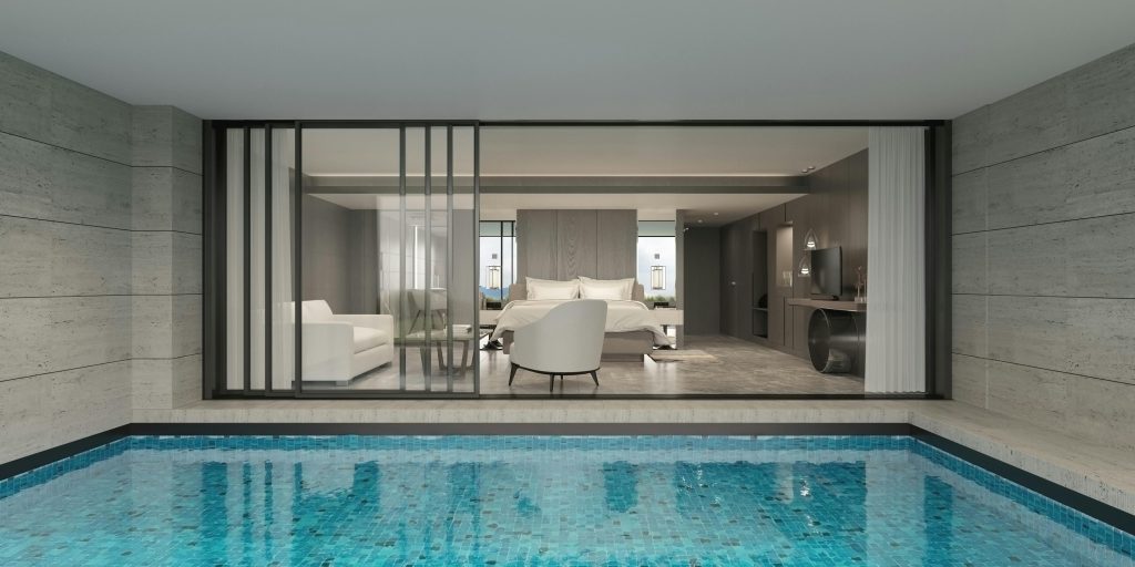 Modern bedroom with poolside outlook.